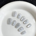 Short Square Press on Nails - Cateye Christmas Winter | Artificial Glossy White Cat Eye Fake Nails with Diamond & Snowflakes, Salon Quality Reusable False Nails Kit for Women & Girls (Size M)