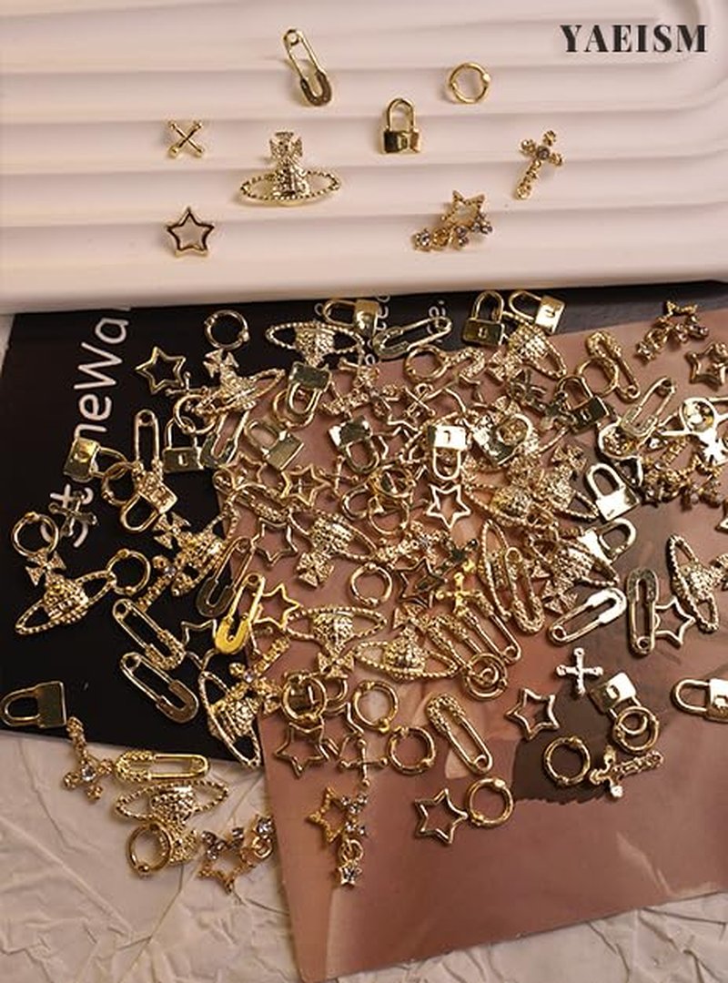 YAEISM 135PCS Gold Nail Charms 3D Nail Spikes Shiny Gold Nail Crosses Alloy Star Nail Charms Punk Goth Pin Planet Nail Art Gems for Women and Girls