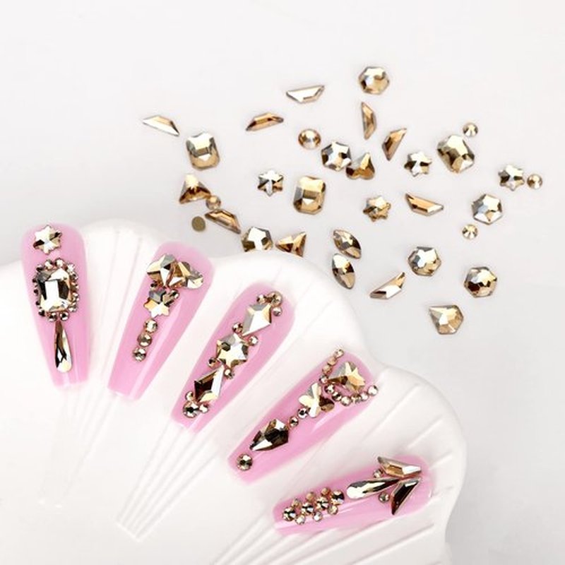 HINABTRU Gold Rhinestones for Nails Champagne Nail Gems Diamonds-7220Pcs Nail Crystals Jewels-Nail Charms Accessories for Nail Decoration(14 Different Shape+ 6520 Round Gold Nail Stones+Wax Pen)