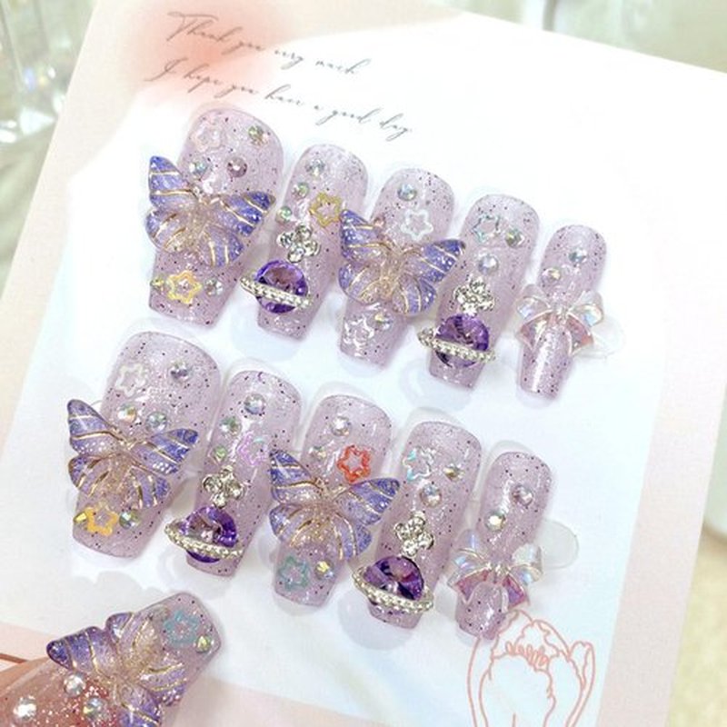 Purple Press on Nails Medium Coffin Fake Nails with Butterfly Bow Rhinestones Star Designs 3D Charm Decoration Handmade Nails Press ons Glitter Acrylic Glue on Nails for Women 24 Pcs