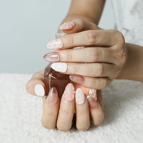 Tesytto Nude Pink Press on Nails Short Almond Cat Eye Fake Nails with 3D Sleek Water Drop Design Glossy Finish Glitter Full Cover Acrylic Nails (Ice Flowers, M)