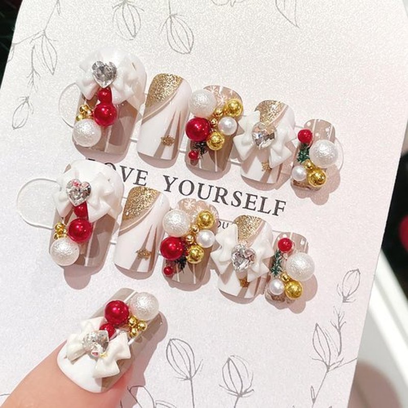 KKUUOO Medium Christmas Fake Nails Handmade Press on Nails Gold Glitter & Bow Design False Nails Pearl Press on Nails Full Cover Stick on Nails Glossy Acrylic Nails for Women and Girls 24Pcs