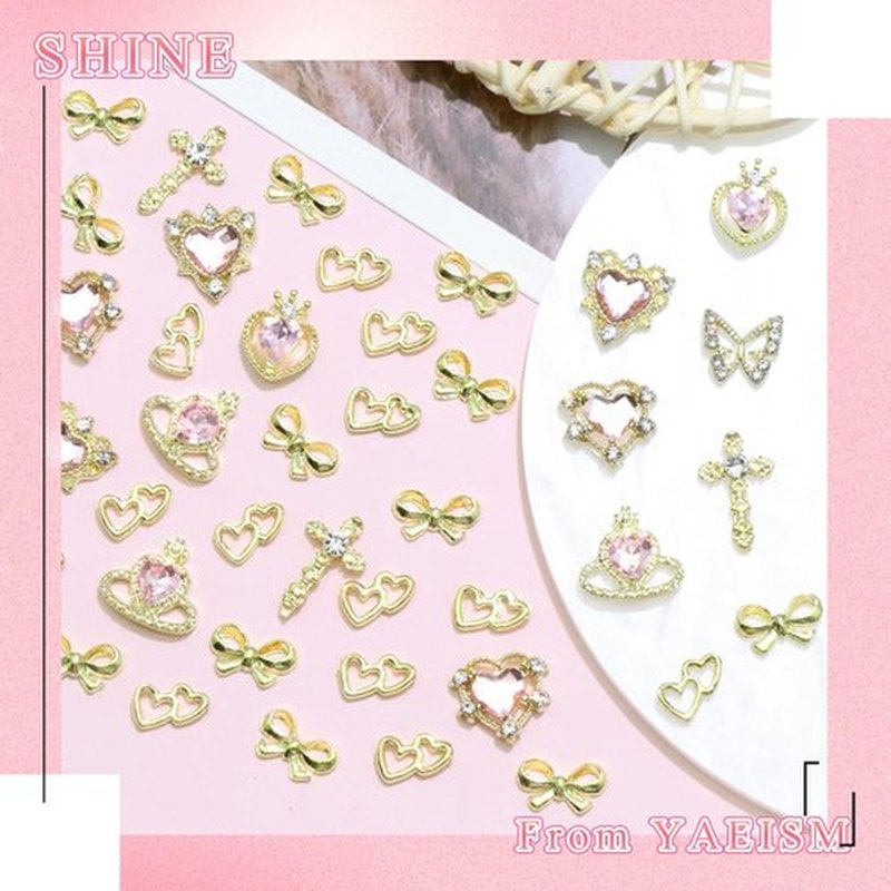 50PCS Gold Nail Charms Shiny Pink Heart Nail Charms Crystal Butterfly Charms Alloy Bowknot Charms 3D Cross Nail Charms for Nail Art and DIY Crafts Decoration