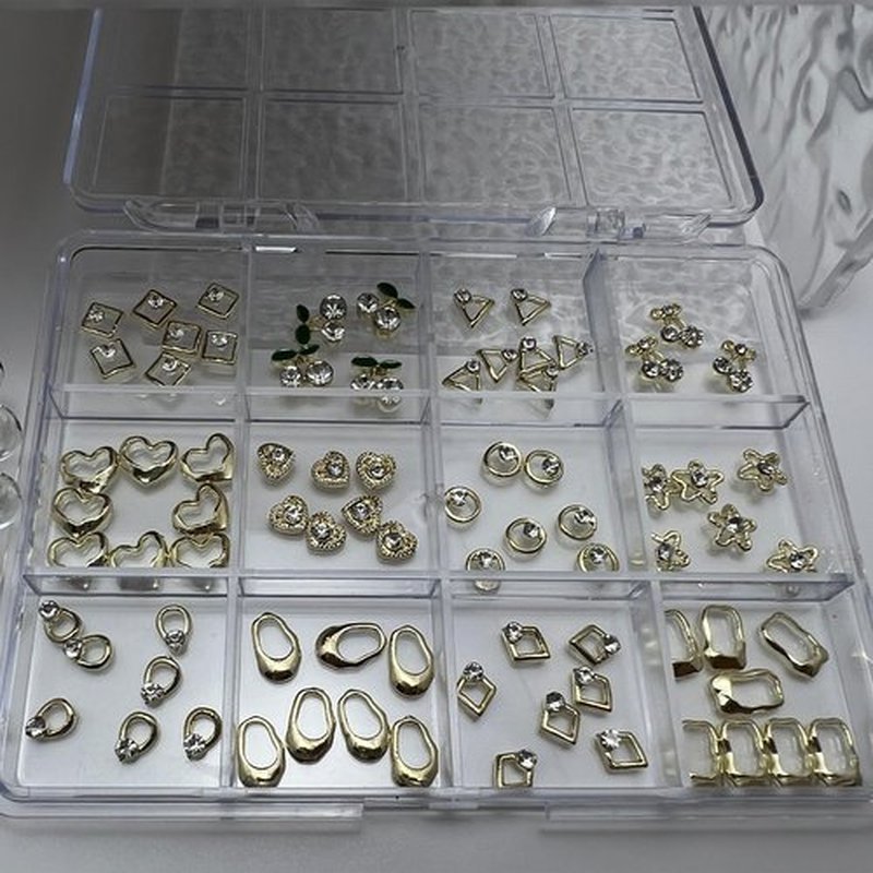 Pizadix 96PCS Gold Nail Charms Kit, 12 Styles 3D Alloy Rhinestones (Hearts/Stars/Leaves & Geometric), 12-Grid Organizer Box & Tweezer, for Gel, Acrylic & Press-On Nails