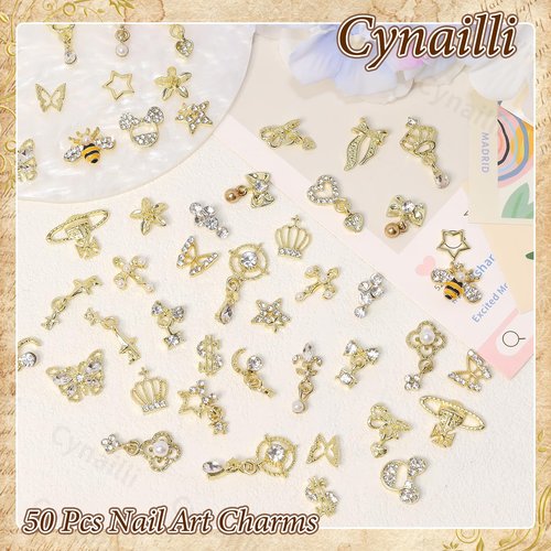 50 Pcs Gold Nail Charms, Gold Dangle Star Heart Bows Nail Charms and Gems Metal Bees Butterfly Crown Planet Cross Dollar Sign Golden Nails Art Supplies for Women DIY Accessories