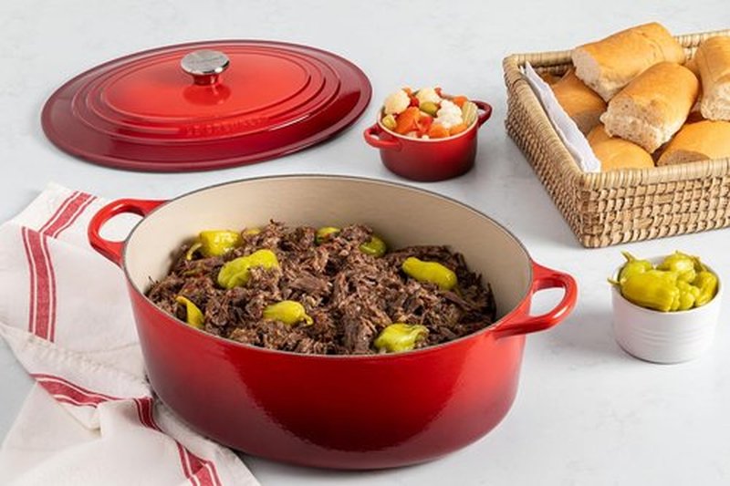 Le Creuset Enameled Cast Iron Dutch Oven - 8 Qt. Signature Oval in Peche with Light Gold Knob
