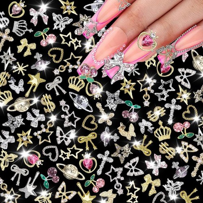 120 Pcs Silver Gold Nail Charms 3D Butterfly Cherry Star Bow Cross Planet Crown Heart Dollar Nail Gems Shiny Nail Rhinestones for Women Nail Art DIY Design（21 Styles