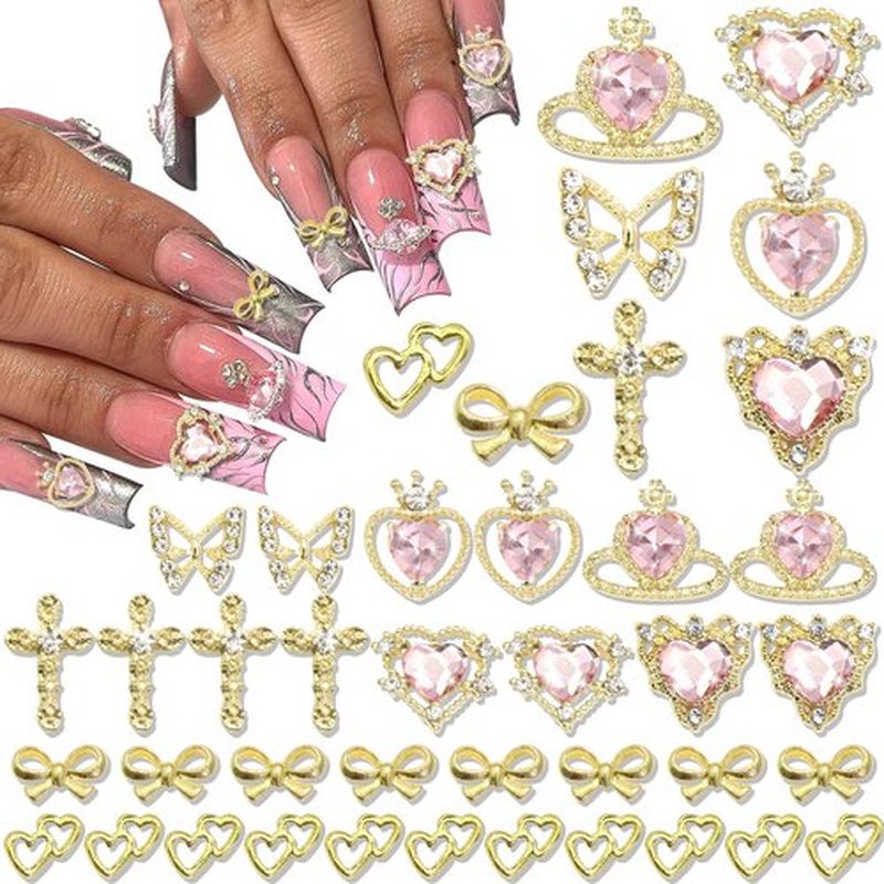 50PCS Gold Nail Charms Shiny Pink Heart Nail Charms Crystal Butterfly Charms Alloy Bowknot Charms 3D Cross Nail Charms for Nail Art and DIY Crafts Decoration